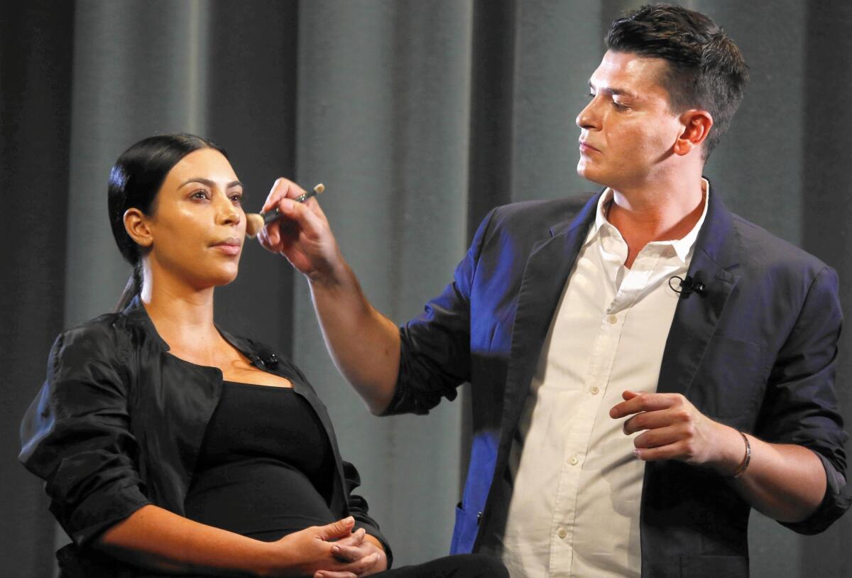Makeup artist Mario Dedivanovic works on Kim Kardashian in front of a paying audience in Pasadena last month. She regularly credits him on Instagram, where celebrity makeup artists can build huge followings.