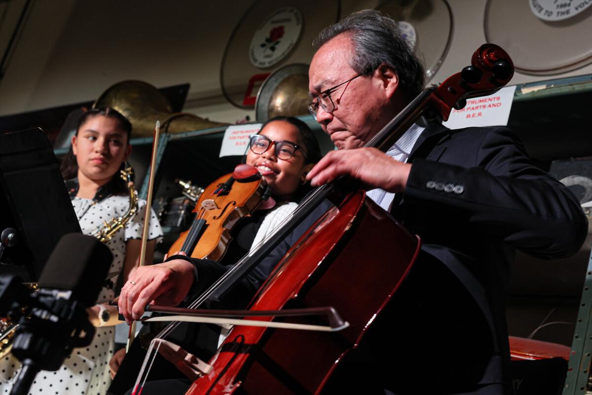 Ma performs with Porche Brinker, center, and Ismerai Calcaneo connected Sunday.