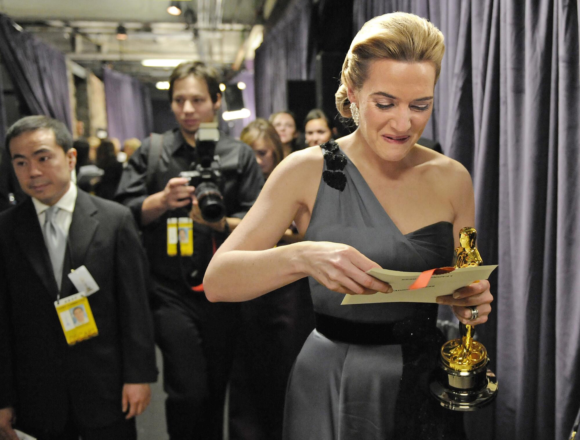 2009: Kate Winslet double-checks the result after her win for lead  actress 