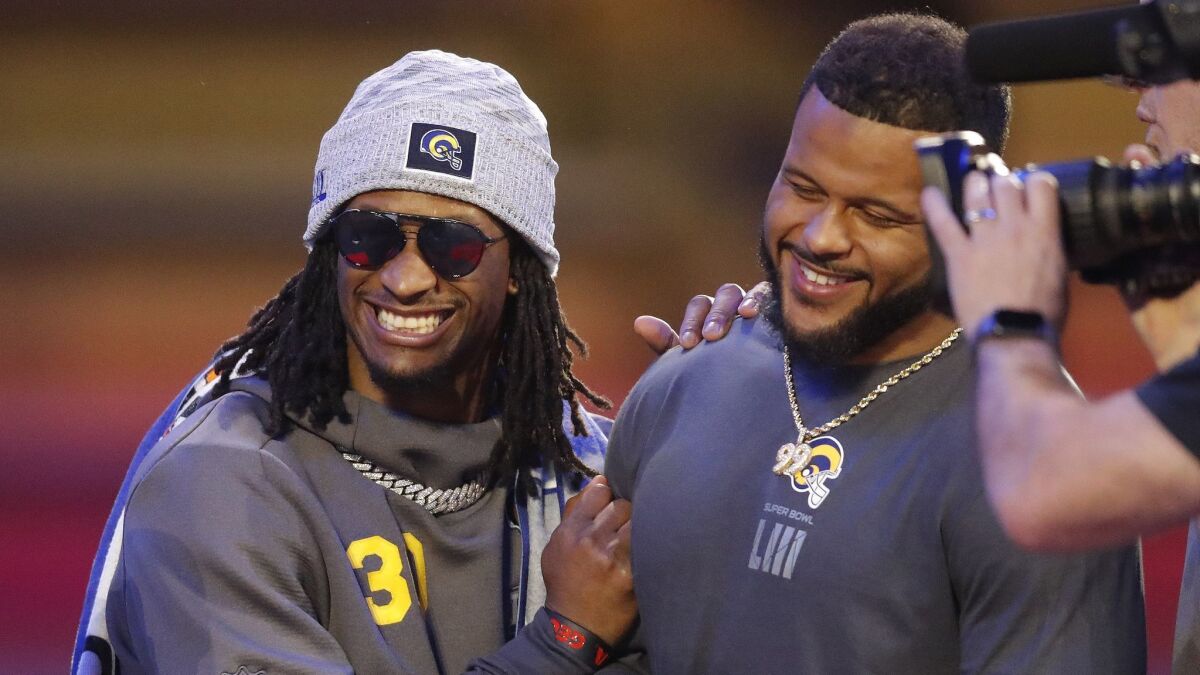 Rams teammates Todd Gurley, left, and Aaron Donald share a laugh at Super Bowl Opening Night.