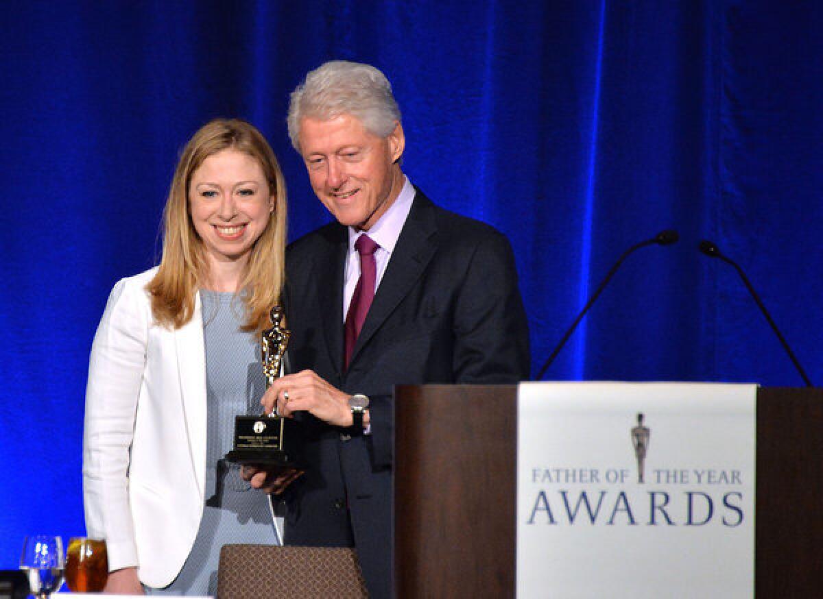 Chelsea Clinton and former President Clinton attend the Father Of The Year Awards at the Grand Hyatt New York.