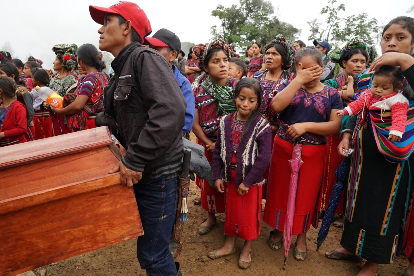 Guatemalan village ravaged by war brings home its dead