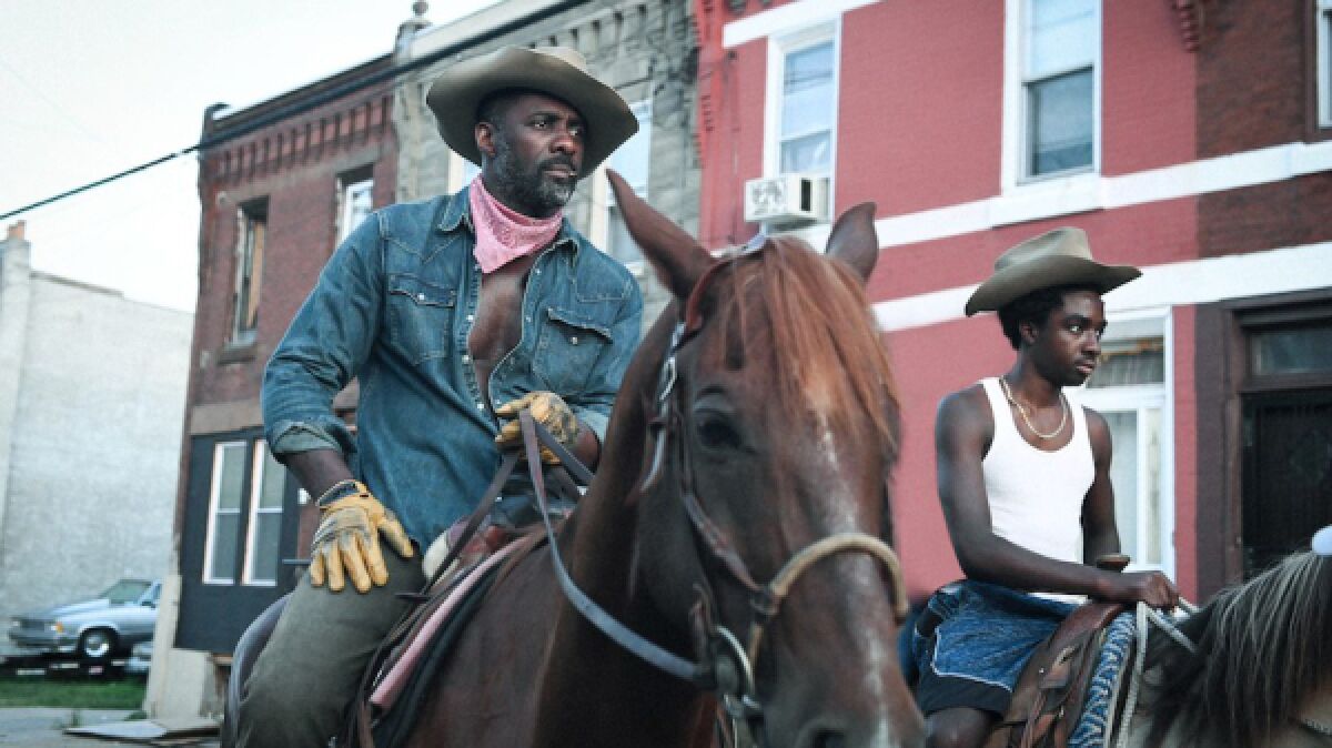 Idris Elba and Caleb McLaughlin in Ricky Staub's "Concrete Cowboy'