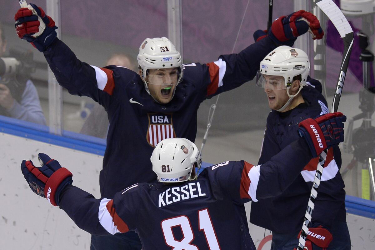 Members of the U.S. squad celebrate during a game against Russia. Emotions will run high against Canada in the semifinals.