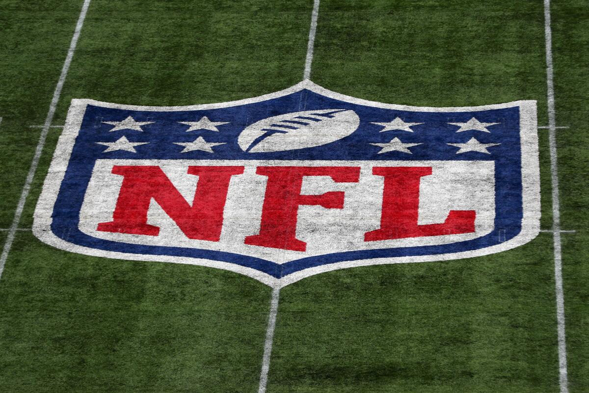  A detailed view of the NFL logo on a field.