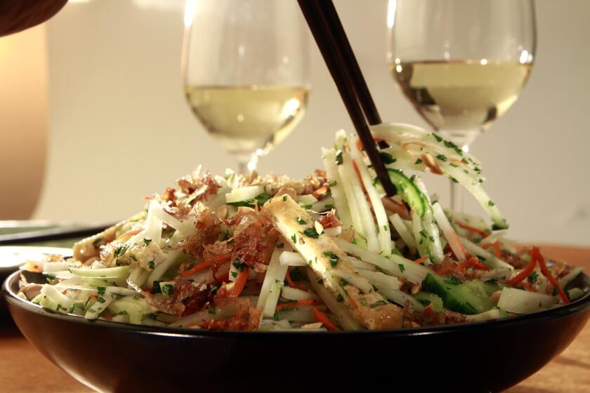 Green papaya salad pairs well with white wine, especially in summer heat.