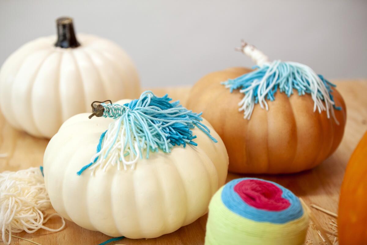 Make your own unicorn pumpkins using string and artificial pumpkins.