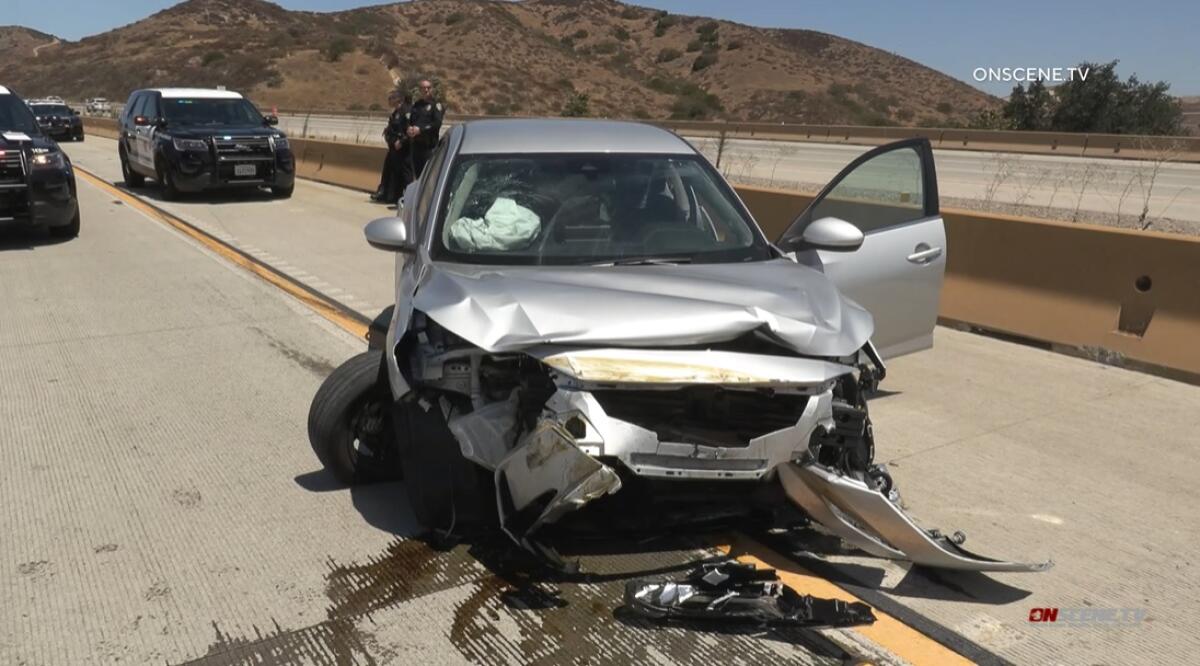 San Diego police said a homicide suspect fled from officers Thursday morning before crashing on SR-52 near Mast Boulevard