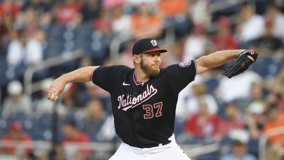 Washington Nationals starting pitcher Stephen Strasburg delivers a pitch during a baseball game against the Baltimore Orioles, May 21, 2021, in Washington. Strasburg, the 2019 World Series MVP, threw the ball on flat ground Sunday, March 13, 2022 as the Nationals held their first official workout of spring training and is slated to go through a live batting practice session Tuesday. Manager Dave Martinez and GM Mike Rizzo described Strasburg as prepping for the regular season and no longer rehabilitating from last year's surgery. (AP Photo/Nick Wass)