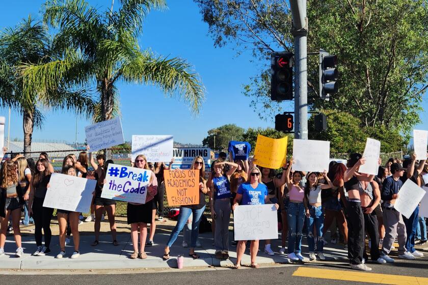 Parents and students outside Ramona High School protesting the dress code policy.
