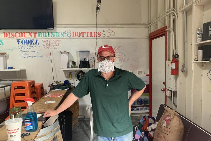 Jason Tripp in his distillery in Pacifica, south of San Francisco, on Wednesday, May 13, 2020. Tripp has been shut down the last week, even as he tries to sell booze and hand sanitizer.