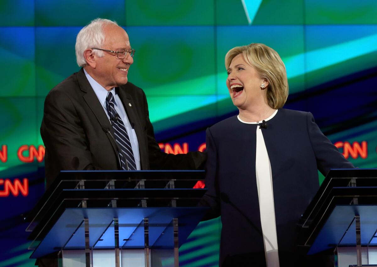 Democratic presidential candidates Bernie Sanders and Hillary Clinton take part in a televised debate in Las Vegas on Oct. 13.