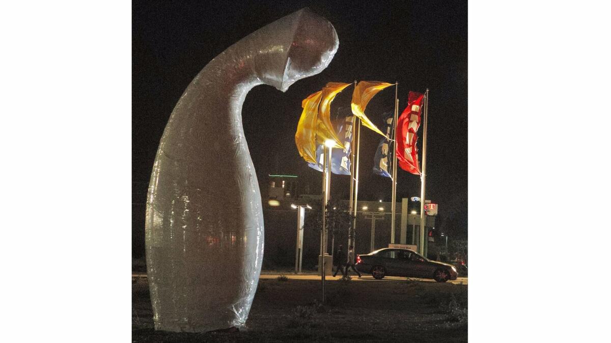 A wrapped sculpture in front of IKEA on San Fernando Road in Burbank on Tuesday. Residents have questioned the phallic shape of the sculpture.