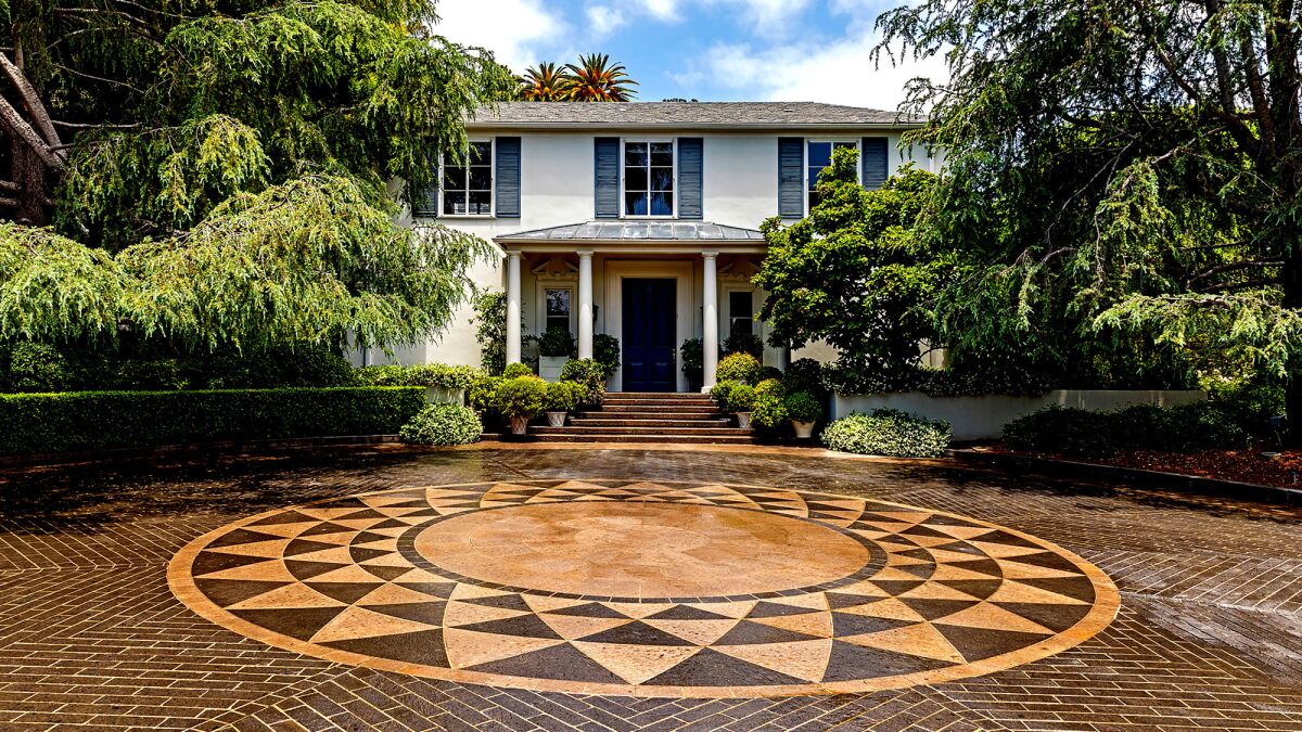 The Oakmont Drive estate sold by investor Bruce Karsh centers on a 1940 Georgian Regency-style home designed by architect James Dolena and styled by former White House interior designer Michael Smith.