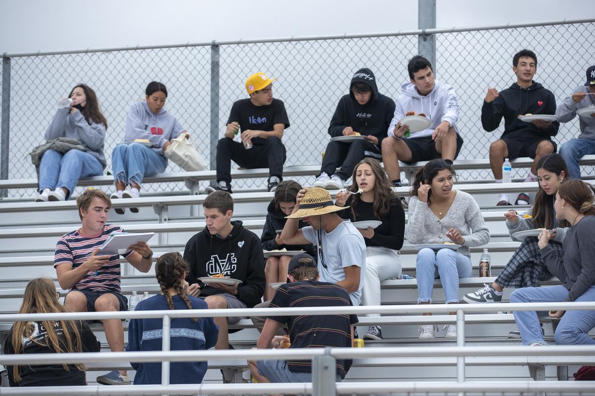 Student-athletes eat lunch during the All-Sports Cup lunch at Costa Mesa High School on Monday.