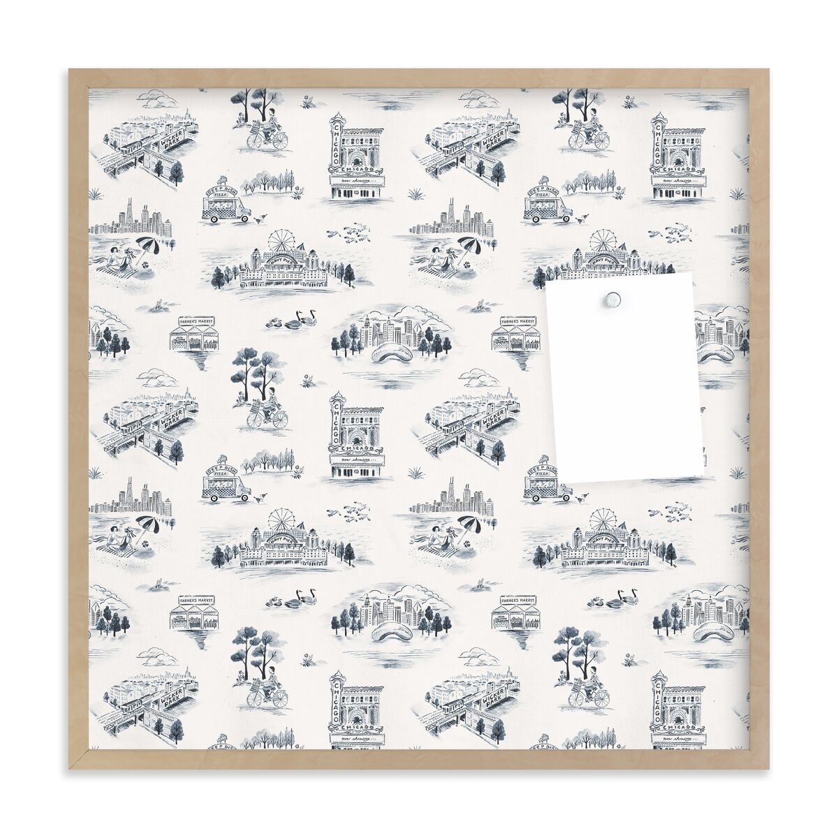 A city-themed toile paper is shown in a framed pin board.