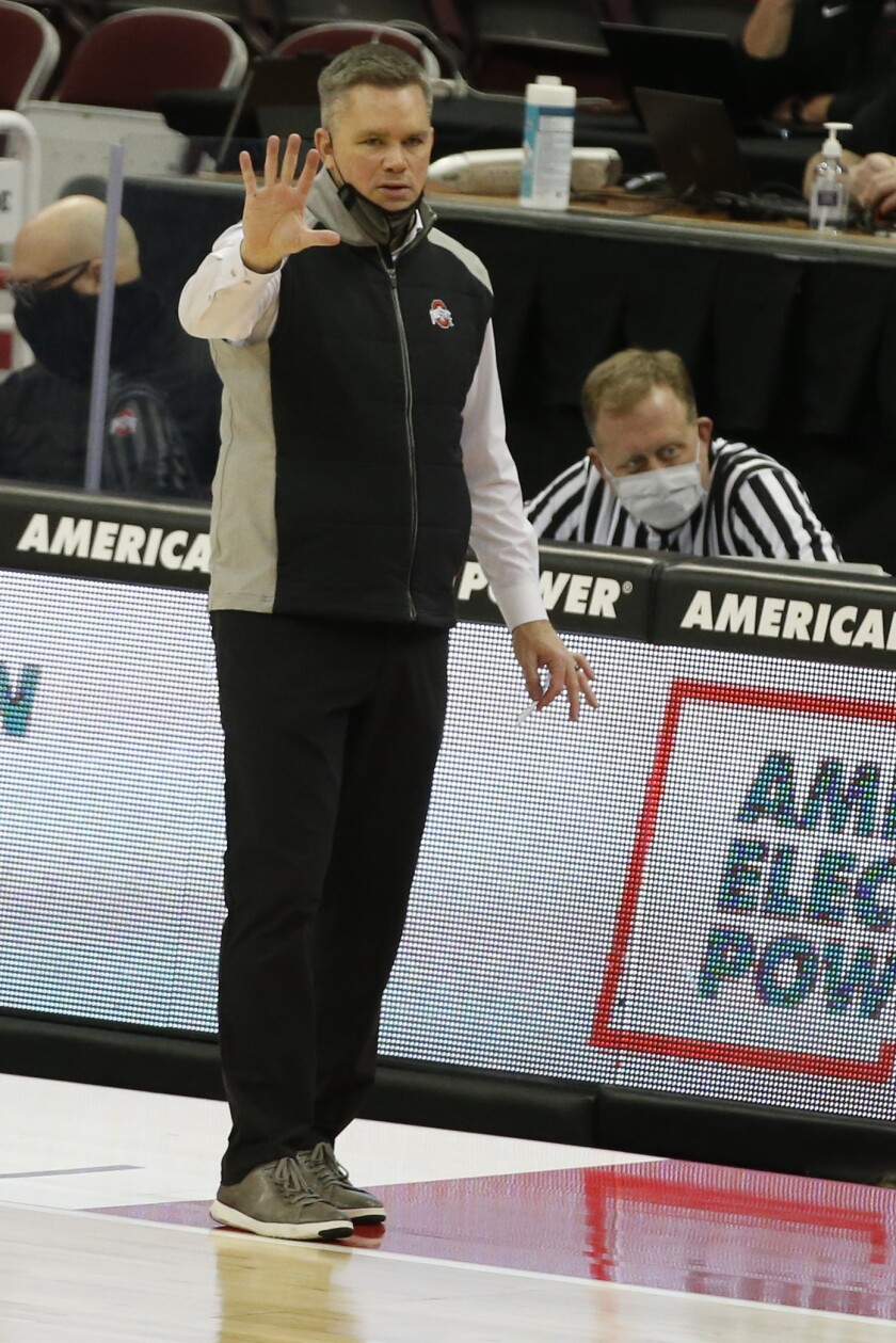 Ohio State head coach Chris Holtmann signals to his team against Iowa during the second half of an NCAA college basketball game Sunday, Feb. 28, 2021, in Columbus, Ohio. (AP Photo/Jay LaPrete)