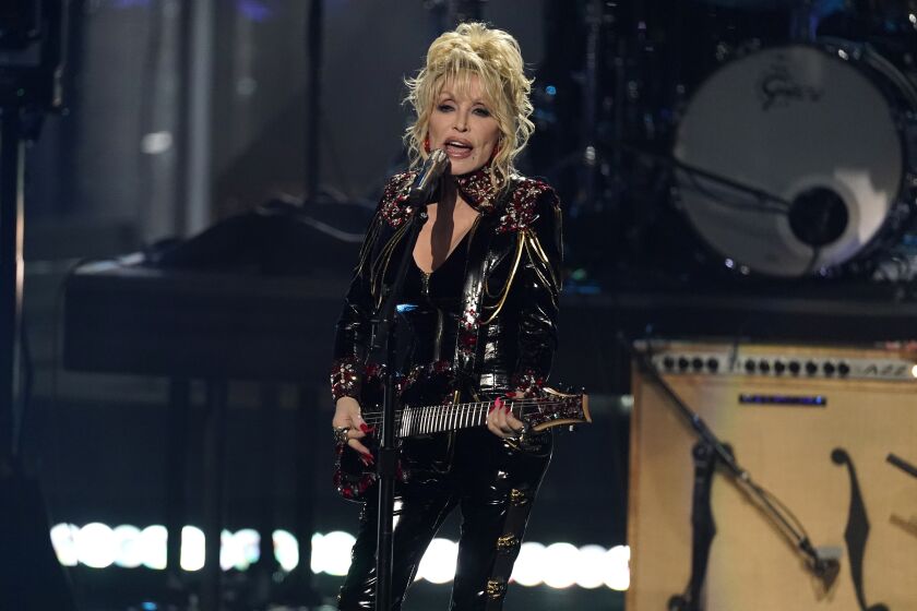 Inductee Dolly Parton performs during the Rock & Roll Hall of Fame Induction Ceremony on Saturday, Nov. 5, 2022, at the Microsoft Theater in Los Angeles. (AP Photo/Chris Pizzello)