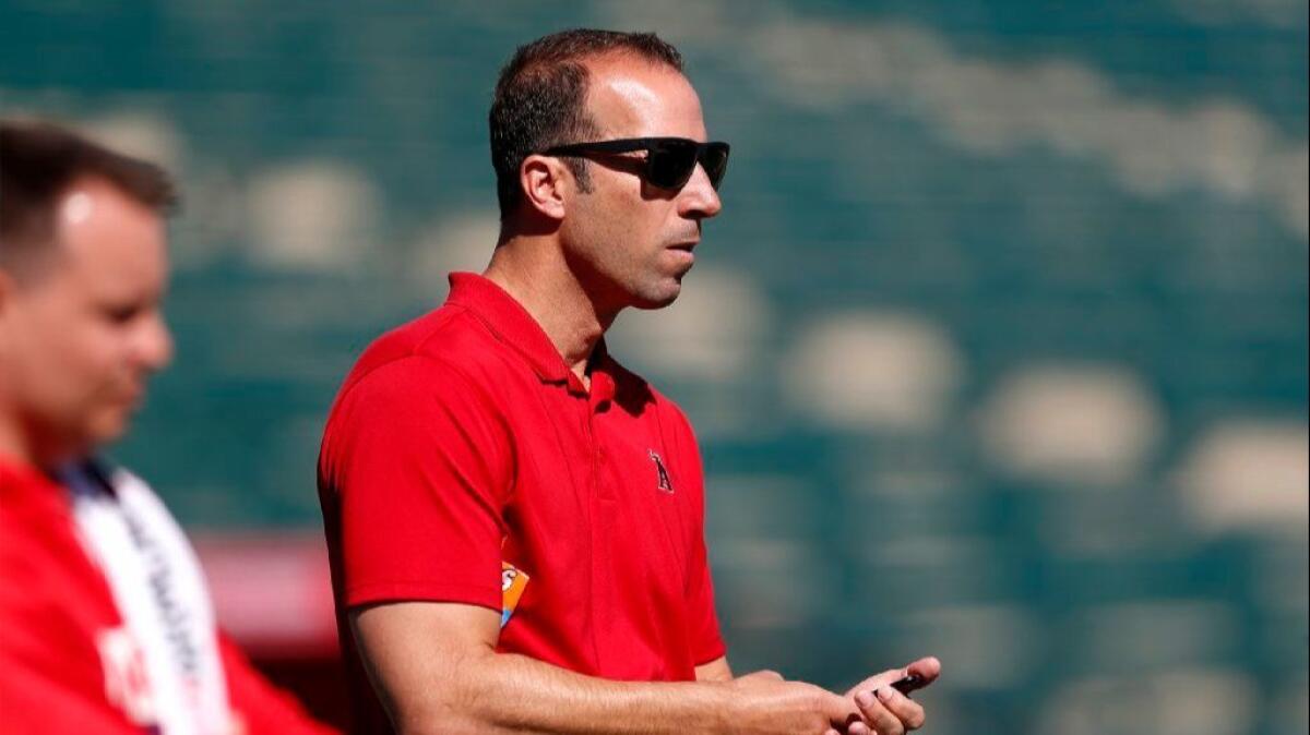 Angels GM Billy Eppler watches batting practice during spring training.