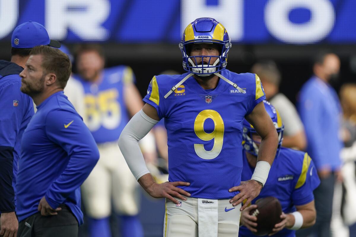 Rams quarterback Matthew Stafford (9) stands on the field before a loss to the San Francisco 49ers on Jan. 9.