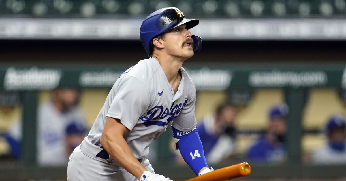 Los Angeles Dodgers' Enrique Hernandez watches his fly ball 