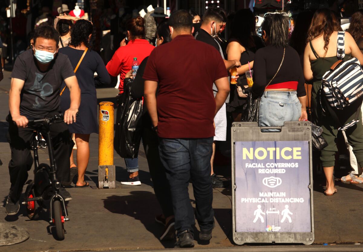 The crowd of shoppers is thick on Santee Alley in downtown Los Angeles.
