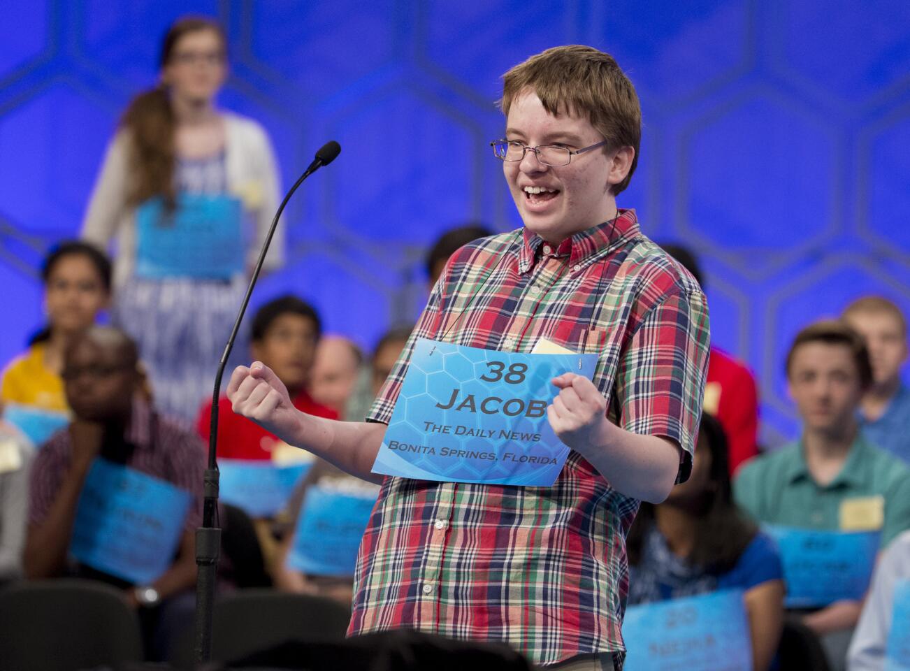 Eighth-grader Jacob Williamson, 15, of Cape Coral, Fla., pumps his fists after hearing his word, "euripus," during the semifinals of the National Spelling Bee.