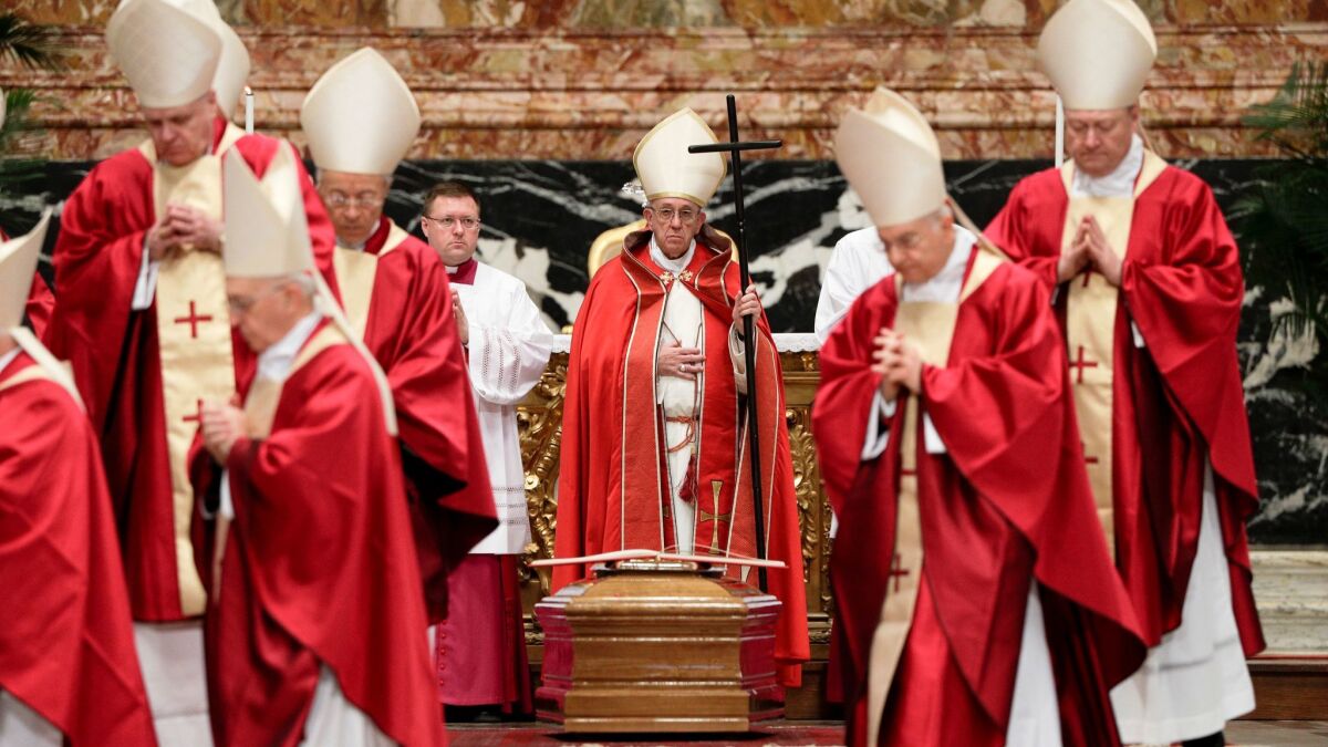 Pope Francis presides over the funeral ceremony for Cardinal Bernard Law on Dec. 21 in St. Peter's Basilica at the Vatican.