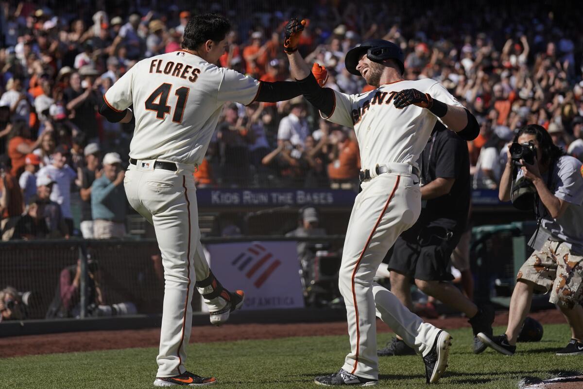SF Giants: New dad Wilmer Flores arrives at camp