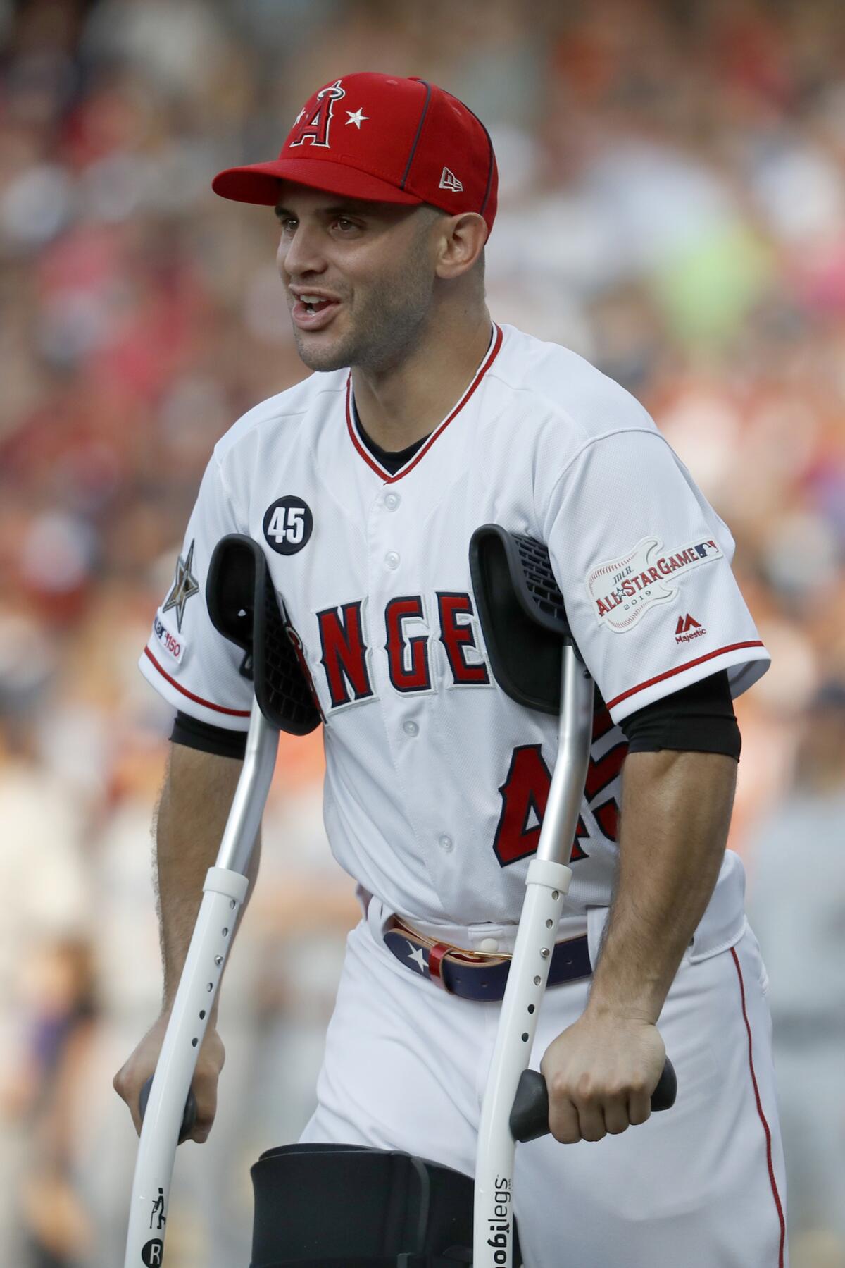 Angels infielder Tommy La Stella wears the number 45 of late Angels pitcher Tyler Skaggs who passed away last Monday, as La Stella is introduced before the start of the MLB All-Star Game on Tuesday in Cleveland.