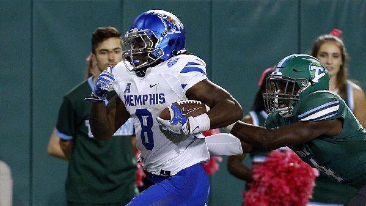 Memphis running back Darrell Henderson, left, sprints for a touchdown as Tulane safety Will Harper tries to push him out of bounds on Oct. 14, 2016.