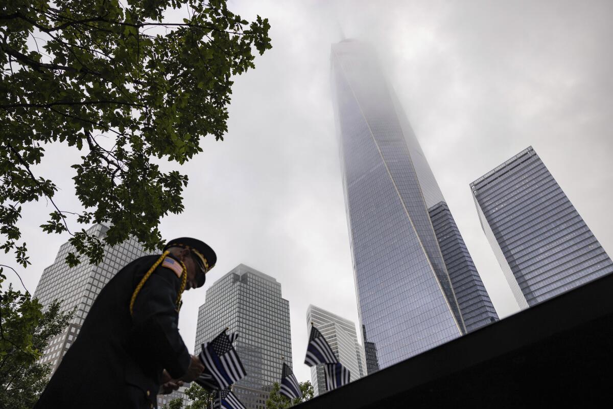 Sam Pulia places flags at the site of the Sept. 11, 2001, terror attacks in New York.