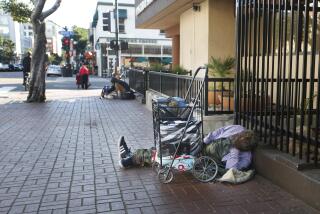 The Supreme Court refused to hear a major case on homelessness, letting stand a ruling that protects homeless people's right to sleep on the sidewalk or in a public park if no other shelter is available. Here, a homeless man sleeps on the sidewalk in downtown San Diego on Dec. 16, 2019.