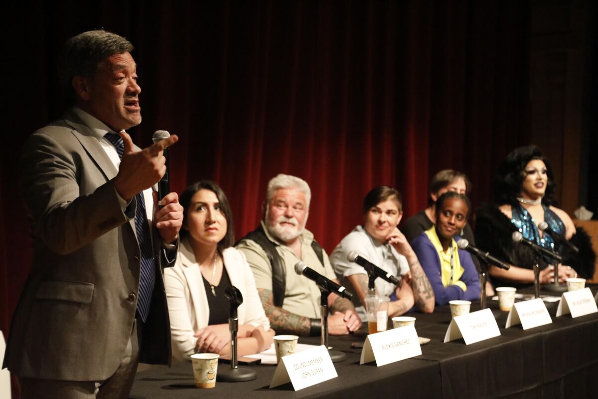 West Hollywood City Councilman John Duran, left, moderates a town hall and panel discussion about sex and the use of substances such as meth, GHB, cocaine and MDMA at the West Hollywood City Council chambers.