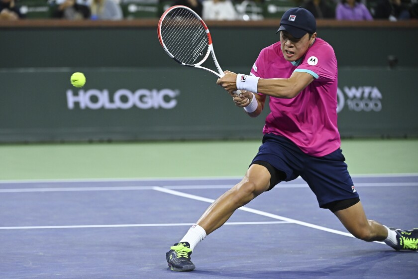 Brandon Nakashima hits a return during the BNP Paribas Open at Indian Wells in March.