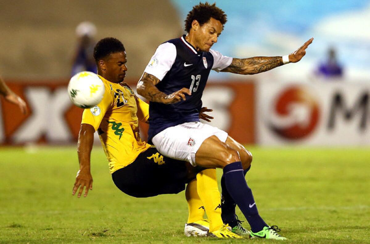 American midfielder Jermaine Jones is tackled hard by Jamaica's Garath McCleary during their World Cup qualifying game on Friday night.