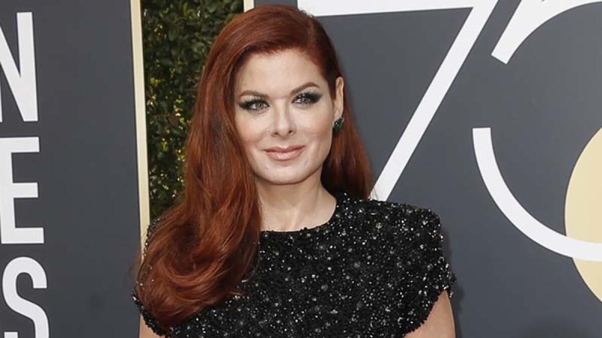 Debra Messing arrives at the 75th Golden Globes.