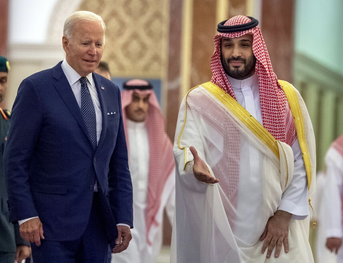 FILE - In this photo released by the Saudi Royal Palace, Saudi Crown Prince Mohammed bin Salman, right, welcomes U.S. President Joe Biden to Al-Salam Palace in Jeddah, Saudi Arabia, July 15, 2022. A federal judge dismissed a U.S. lawsuit against Saudi Crown Prince Mohammed bin Salman in the Saudi killing of U.S.-based journalist Jamal Khashoggi on Tuesday, Dec. 6, 2022, bowing to the Biden administration's insistence that the prince was legally immune in the case.(Bandar Aljaloud/Saudi Royal Palace via AP, File)