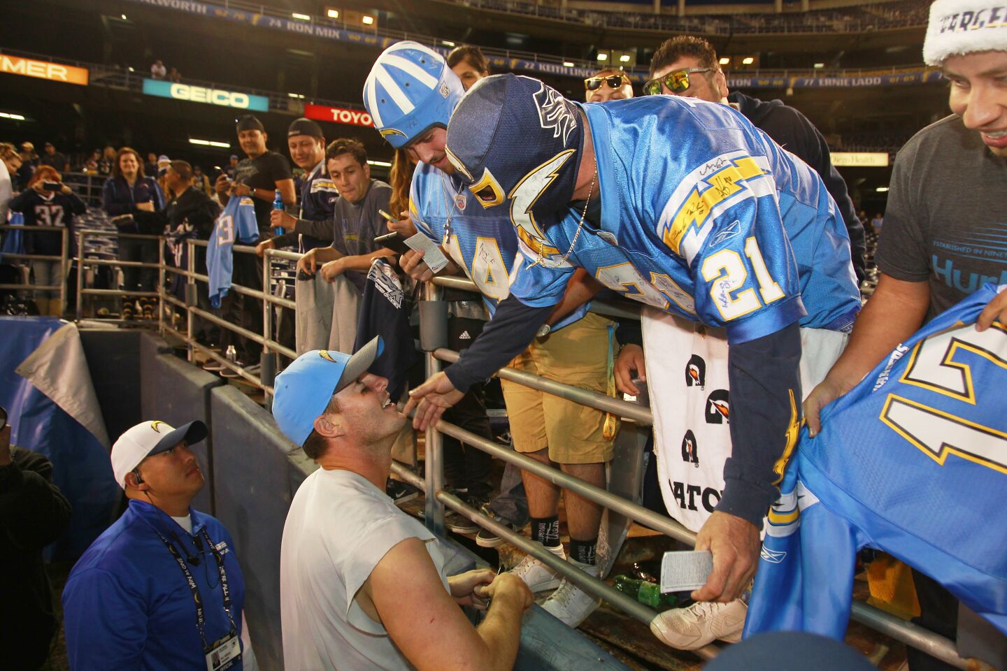 Chargers quarterback Philip Rivers hugs fan Renan Pozo after a 30-14 win over Miami on Dec. 20, 2015.