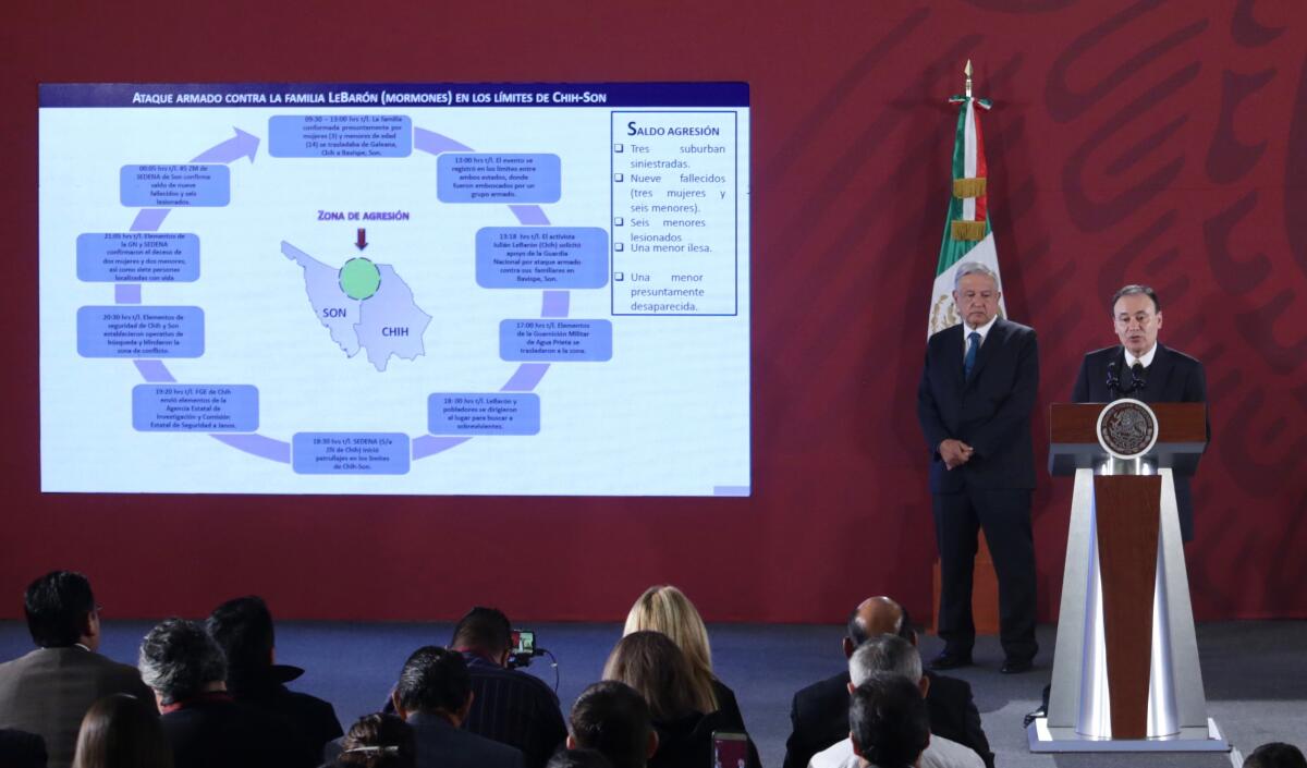 President Andres Manuel Lopez Obrador, left, and the secretary of public security, Alfonso Durazo, hold a news conference Nov. 5 in Mexico City.