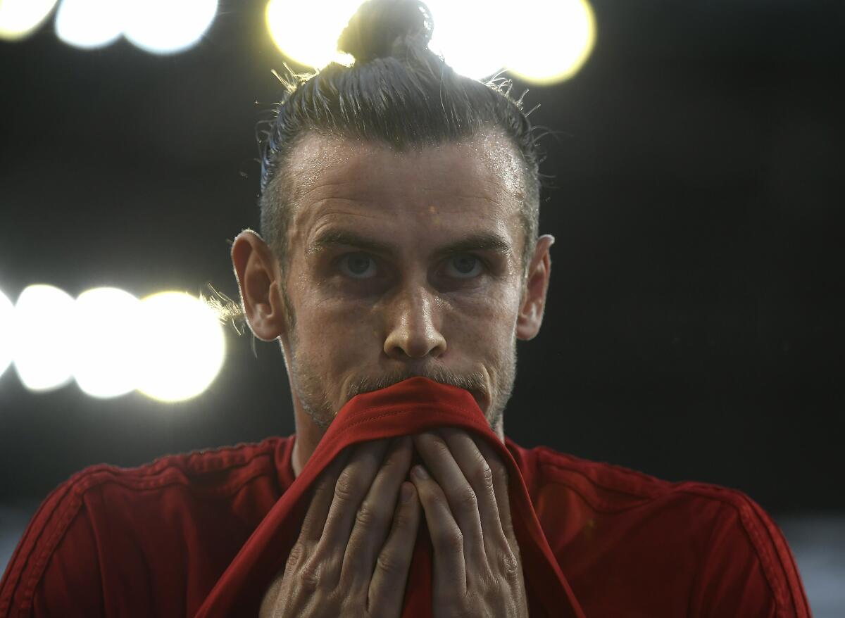 Gareth Bale of Wales warms up prior to the men's soccer 2020 European Championship Group E qualifying match between Hungary and Wales in Groupama Arena in Budapest, Hungary, Tuesday, June 11, 2019. (Tamas Kovacs/MTI via AP)