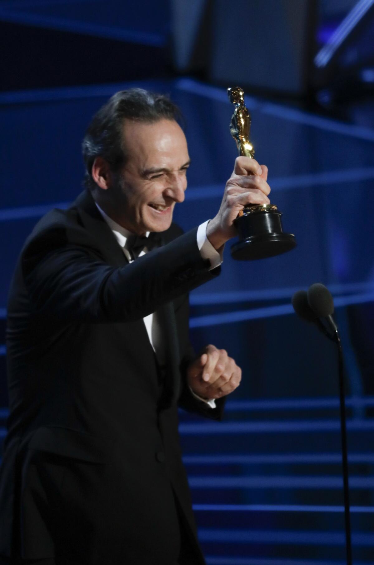 Alexandre Desplat accepting his Oscar for "The Shape of Water's" original score during the 90th Academy Awards on Sunday, March 4, 2018.