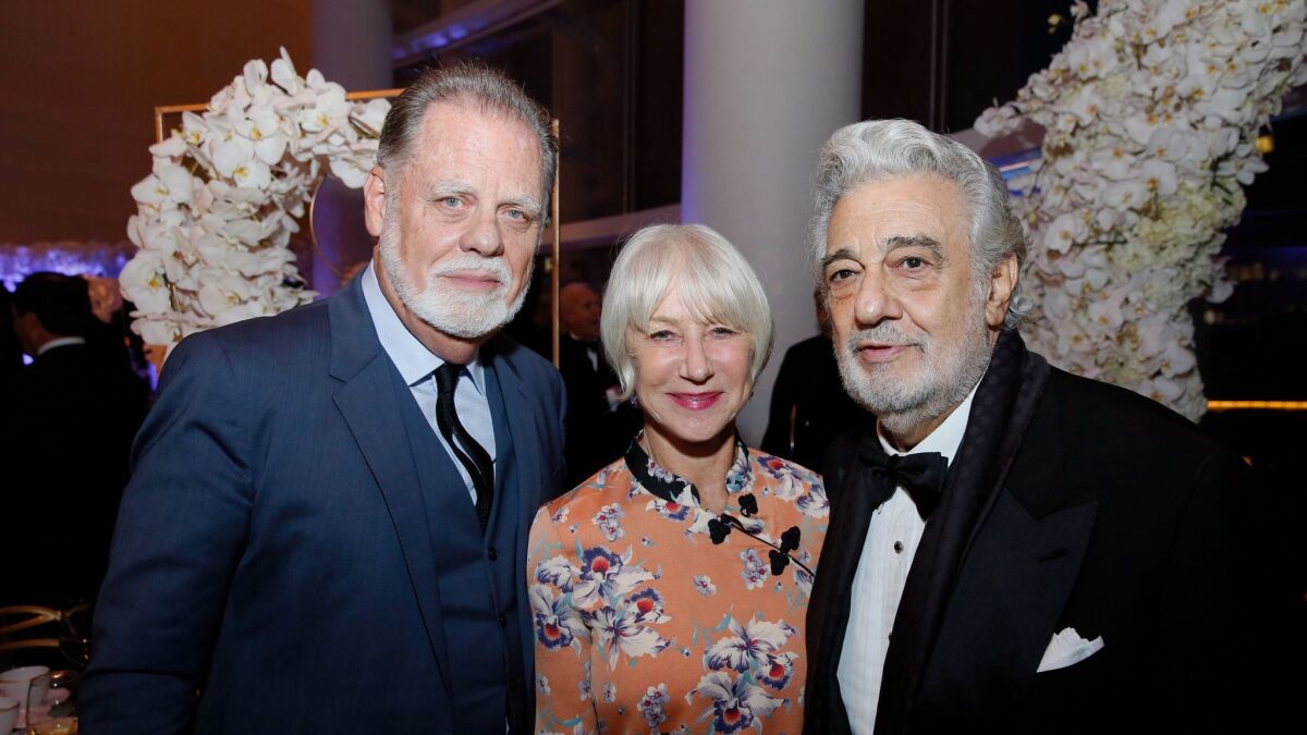 Taylor Hackford, left, Dame Helen Mirren, center and Placido Domingo at the South Coast Plaza Art, Excellence + Friendship, an evening with the Mariinsky Theatre Orchestra at Segerstrom Center for the Arts Monday, October 30, 2017.