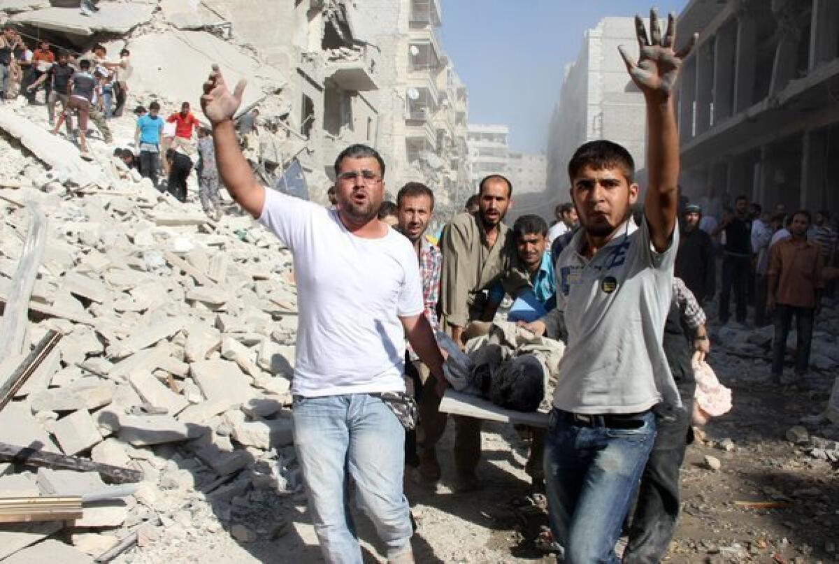 Syrians evacuate a victim following an airstrike by government forces in the northern city of Aleppo.