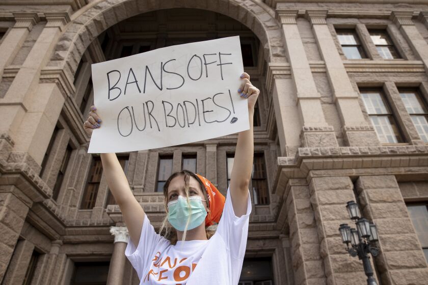 FILE - In this Sept. 1, 2021, file photo, Jillian Dworin participates in a protest against the six-week abortion ban at the Capitol in Austin, Texas. Young people on social media have found a way to protest Texas' new law banning most abortions by focusing on a website established by the state's largest anti-abortion group that takes in tips on violations.(Jay Janner/Austin American-Statesman via AP, File)