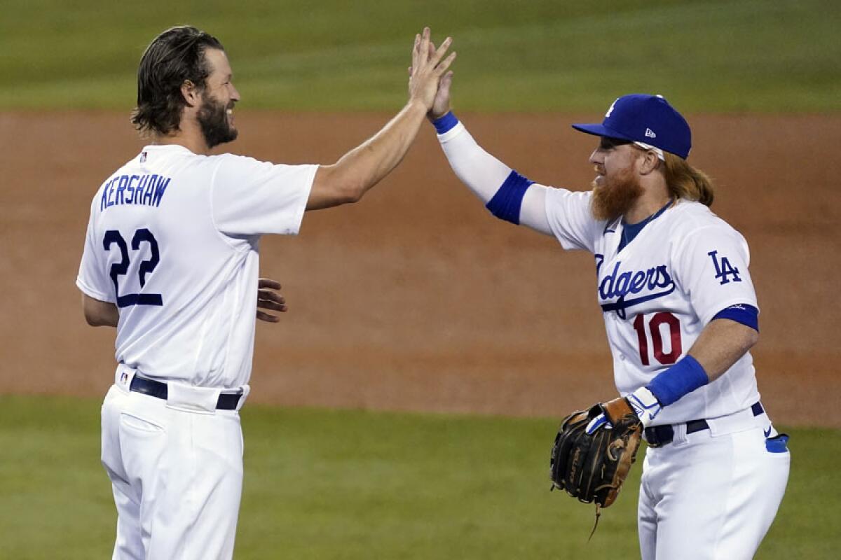 Clayton Kershaw and Justin Turner celebrate the Dodgers' victory Thursday.