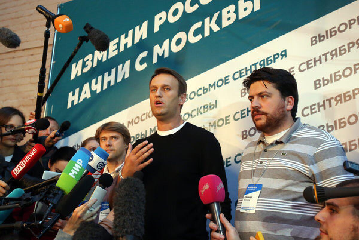 Opposition leader Alexei Navalny speaks to reporters shortly after the polls closed in Sunday's mayoral election in Moscow.