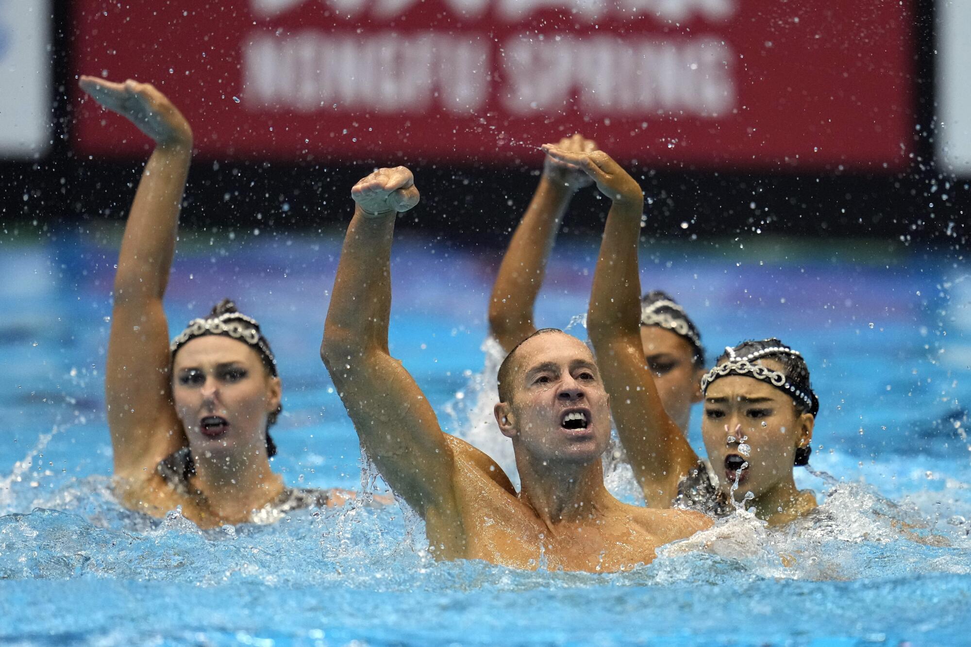 Bill May competes with the U.S. during the team acrobatic of artistic swimming competition 