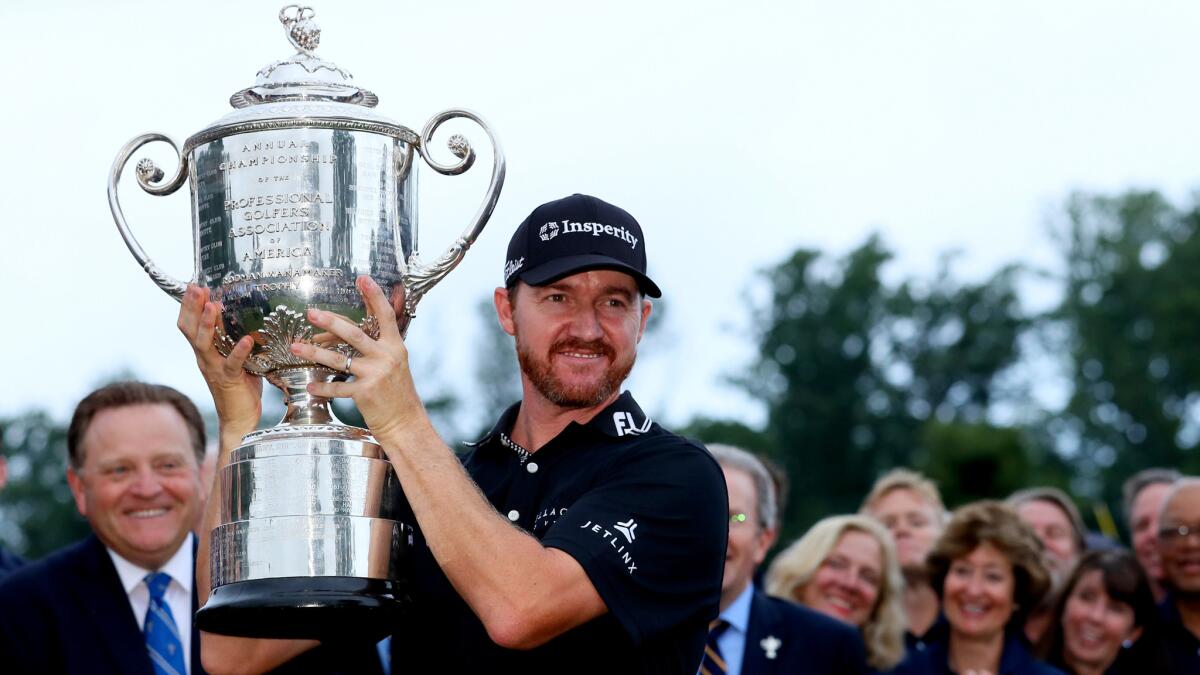 Jimmy Walker hoists the Wanamaker Trophy after winning the PGA Championship on Sunday.