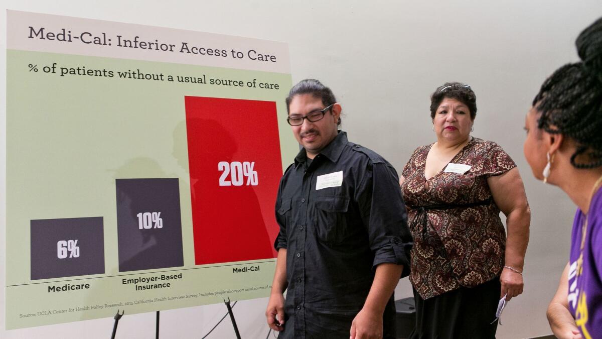 Plaintiffs Saul Jimenez Perea and his mother, Analilia, arrive at a news conference to announce a suit filed by attorneys with the Mexican American Legal Defense and Educational Fund and the Civil Rights Education and Enforcement Center in Los Angeles on July 12.